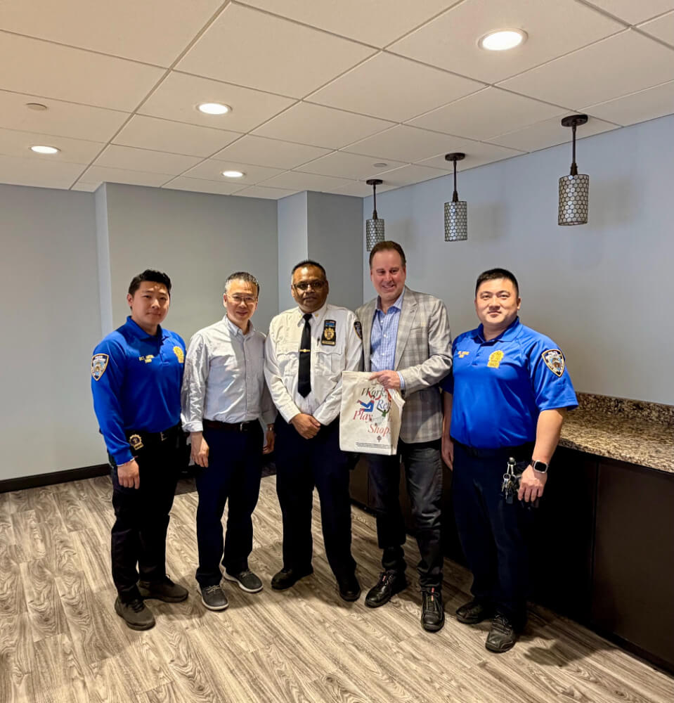 Judson Ain with 109th Precinct CO
              & Community Affairs Officers and BID
              Director Dian Yu